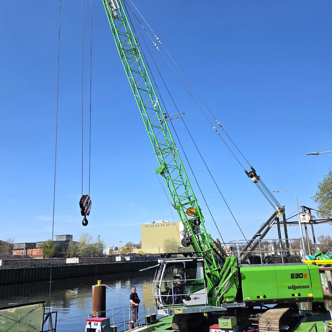 Sennebogen 630 E duty cycle crane mounted on a pontoon working on inland waterways near Berlin