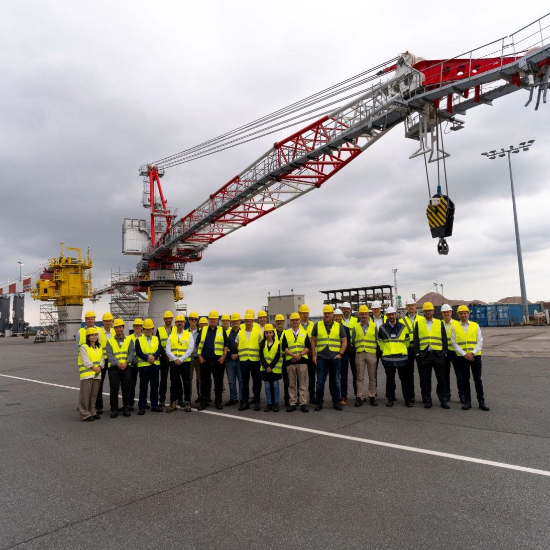 Participants at the Liebherr Offshore Summit 2026 in Rostock, with the electric BOS 4600 E offshore crane on show