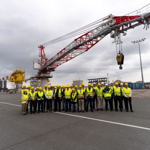 Participants at the Liebherr Offshore Summit 2026 in Rostock, with the electric BOS 4600 E offshore crane on show