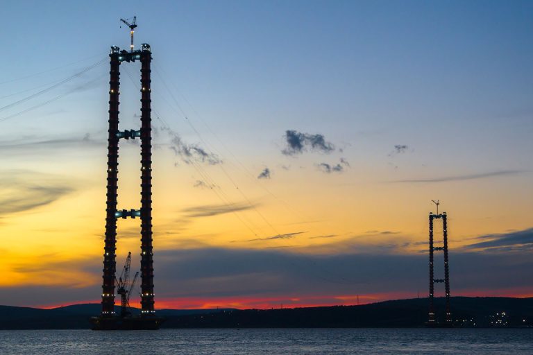 Two Liebherr 357 HC-L luffing jib tower cranes on a pylon of the Canakkale Bridge in Turkiye