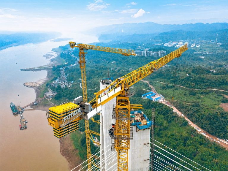 Potain MCT 560 M25 topless tower cranes on the south tower of the Shituo Yangtze River Bridge in Chongqing, China