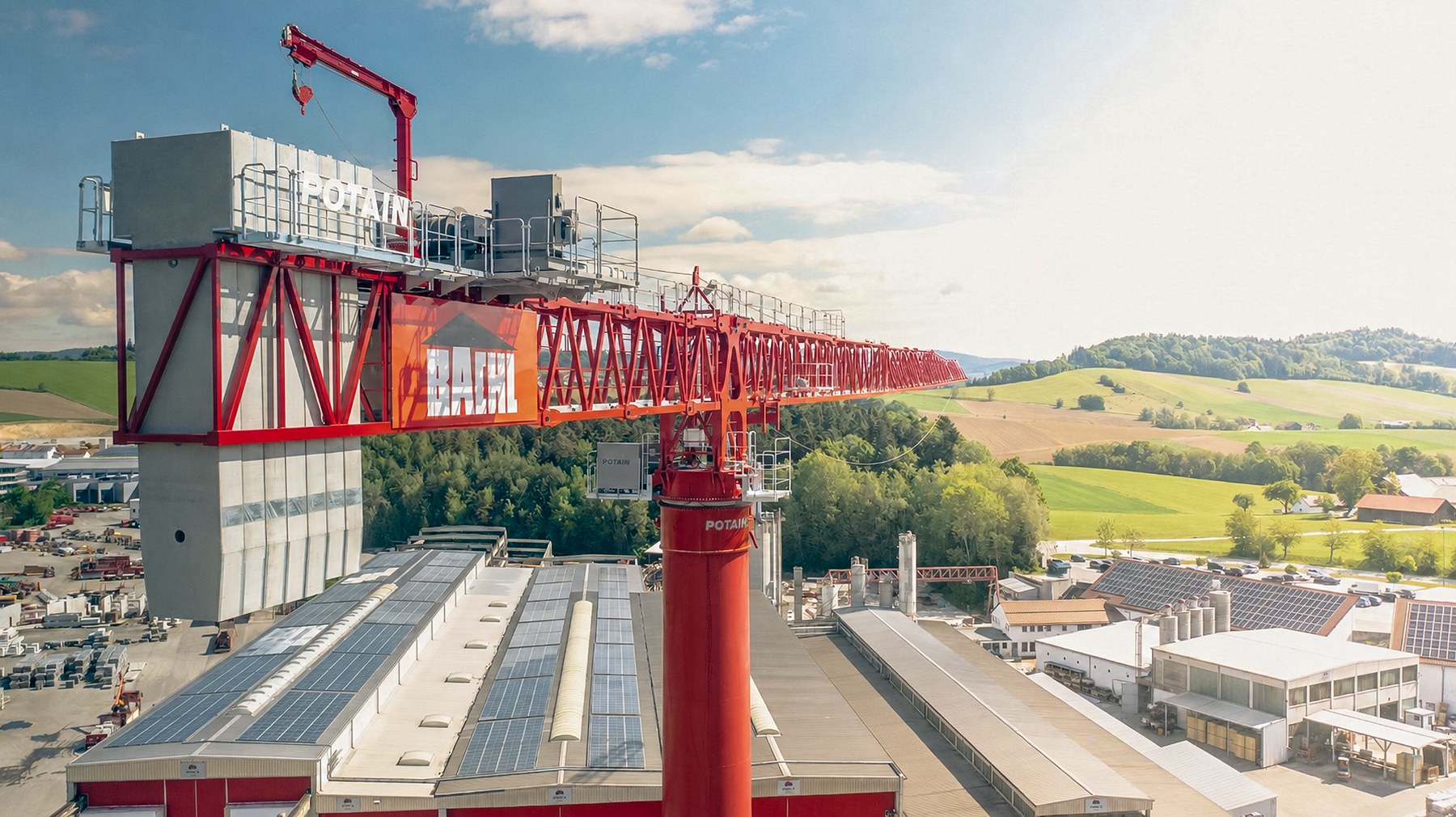 Potain MDT 1609 tower crane handling precast concrete at the Karl Bachl Betonwerke storage yard
