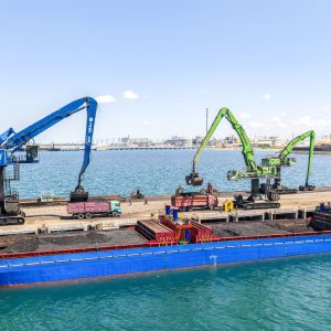 Sennebogen material handlers unloading a bulk carrier at Yesilyurt deep-sea port near Samsun, Turkey