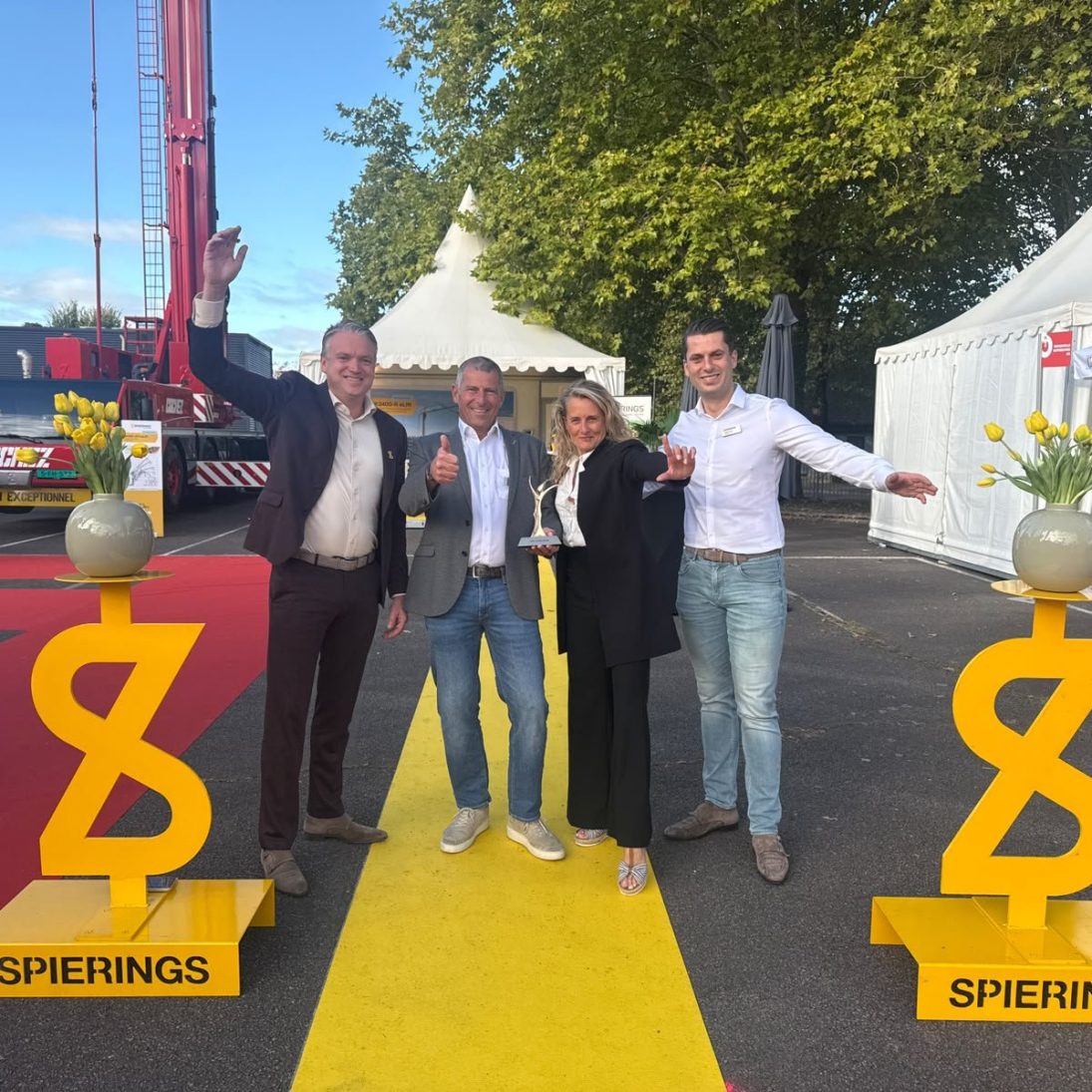 Spierings team receiving the JDL d'Or 2026 award for eLift electric lifting technology at JDL Expo in Beaune