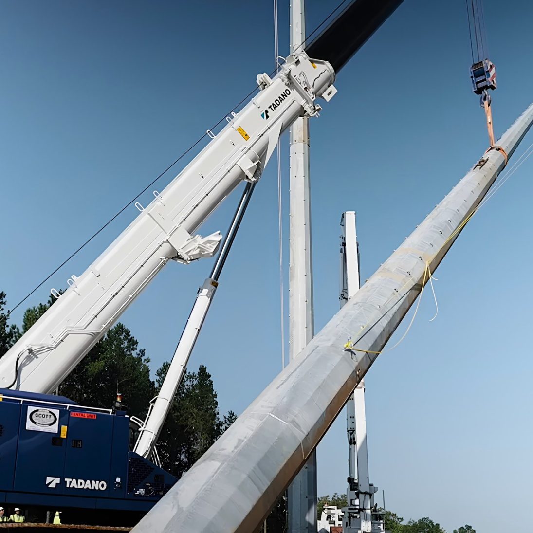 Tadano GTC-600-2 telescopic boom crawler crane setting 230 kV transmission structures in Mississippi
