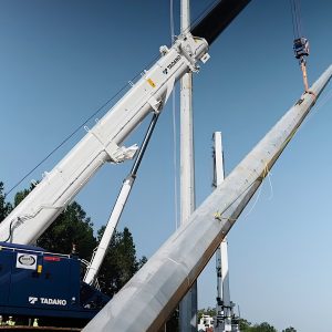 Tadano GTC-600-2 telescopic boom crawler crane setting 230 kV transmission structures in Mississippi