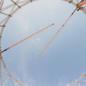 Three Liebherr EC-B flat-top tower cranes over the Bovisa gasometer site in Milan