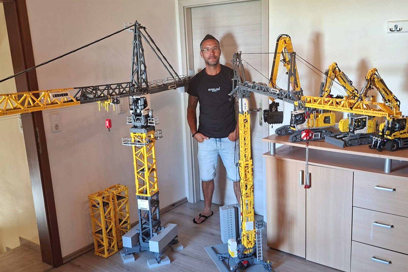 Thomas Koermer with his remote-controlled Lego replica of a Liebherr EC-H series top-slewing tower crane