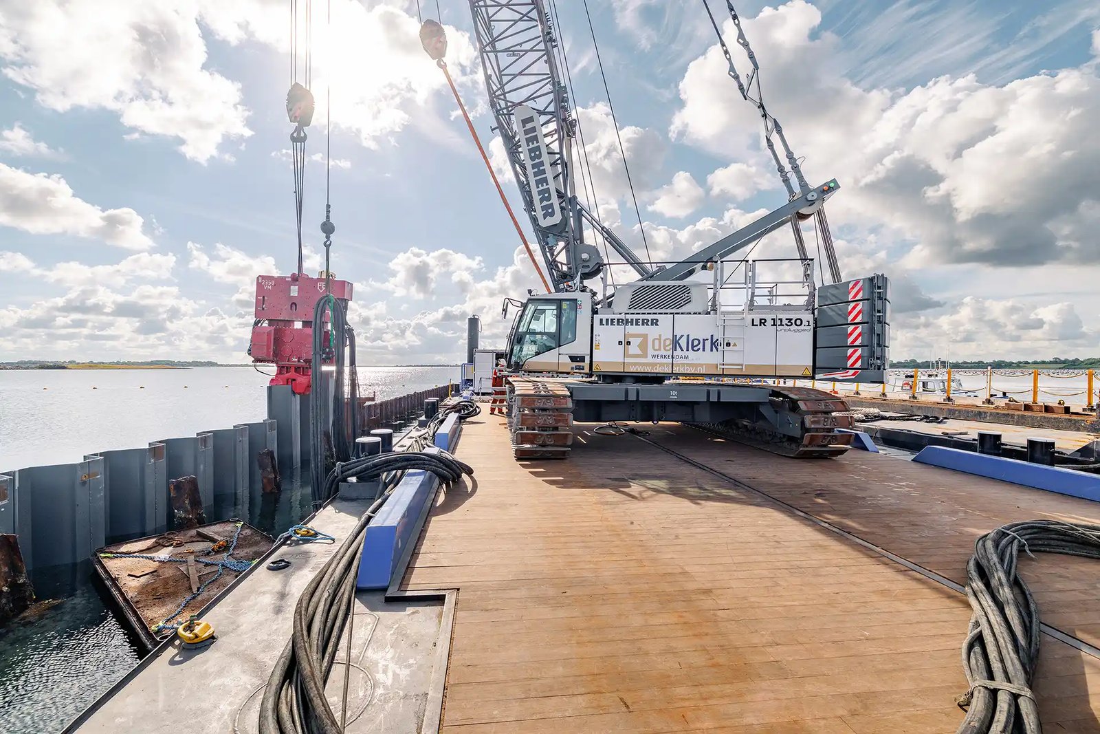 Liebherr LR 1130.1 unplugged battery-powered crawler crane installing sheet piles at the Brouwer lock complex in the Netherlands