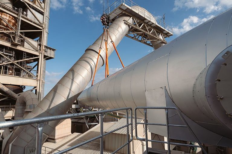Liebherr LTM 1650-8.1 of Wiesbauer lifting a 33-tonne pipe with centimetres of clearance at the Holcim cement works in Dotternhausen