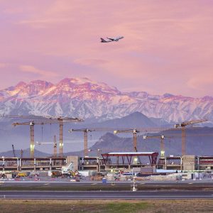 Rail-mounted Liebherr 250 EC-B 12 Litronic flat-top tower crane at the Nueva Pudahuel airport expansion in Santiago de Chile