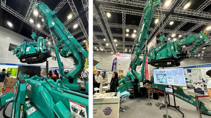 Maeda MC815 spider crane lifting an MC285C mini crane at the ONEBUILD 2026 exhibition in Kuala Lumpur