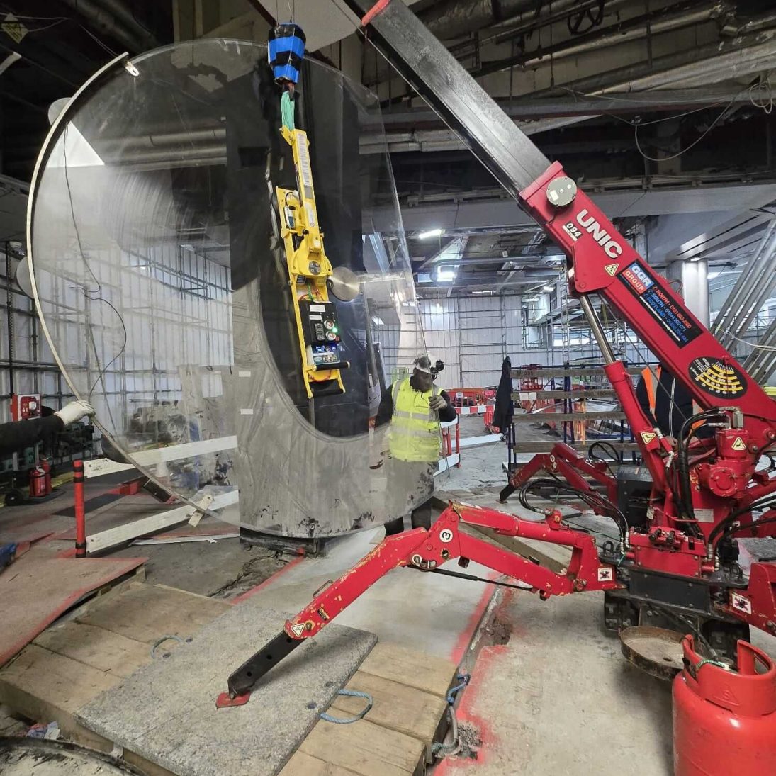 UNIC URW-094 spider crane with boom raised on a jobsite