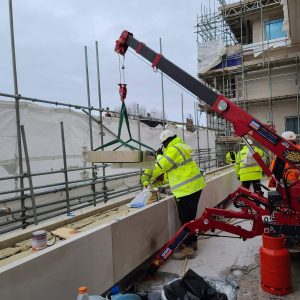 UNIC URW-094 mini spider crane working in a confined space